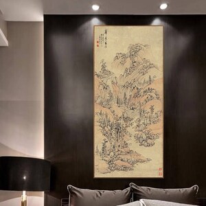 May include: A black and white ink painting of a mountain landscape with a river flowing through it. The painting is framed and hanging on a wall in a modern bedroom.