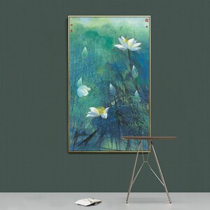 May include: A framed painting of white lotus flowers in a blue and green watercolor style. The flowers are surrounded by green leaves and stems.