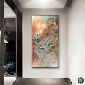May include: A framed vertical painting depicting two dragons. One dragon is silver, the other is gold. The background features a fiery gradient of red, orange, and yellow. The artwork is displayed in a hallway with a dark doorway and a vase of flowers.
