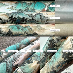 May include: Close-up of rolled canvas prints with different textures, including Xuan paper, silk, matte silk, cotton canvas, and polyester canvas. The prints feature a traditional Chinese landscape painting with mountains, water, and trees in shades of blue, green, and brown.