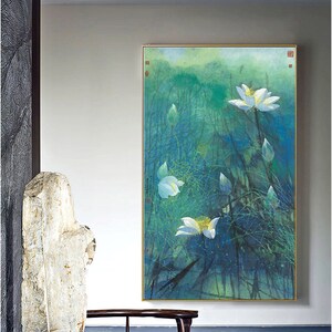 May include: A framed painting of white lotus flowers in a pond with a green and blue background. The painting is in a gold frame and is hanging on a white wall.