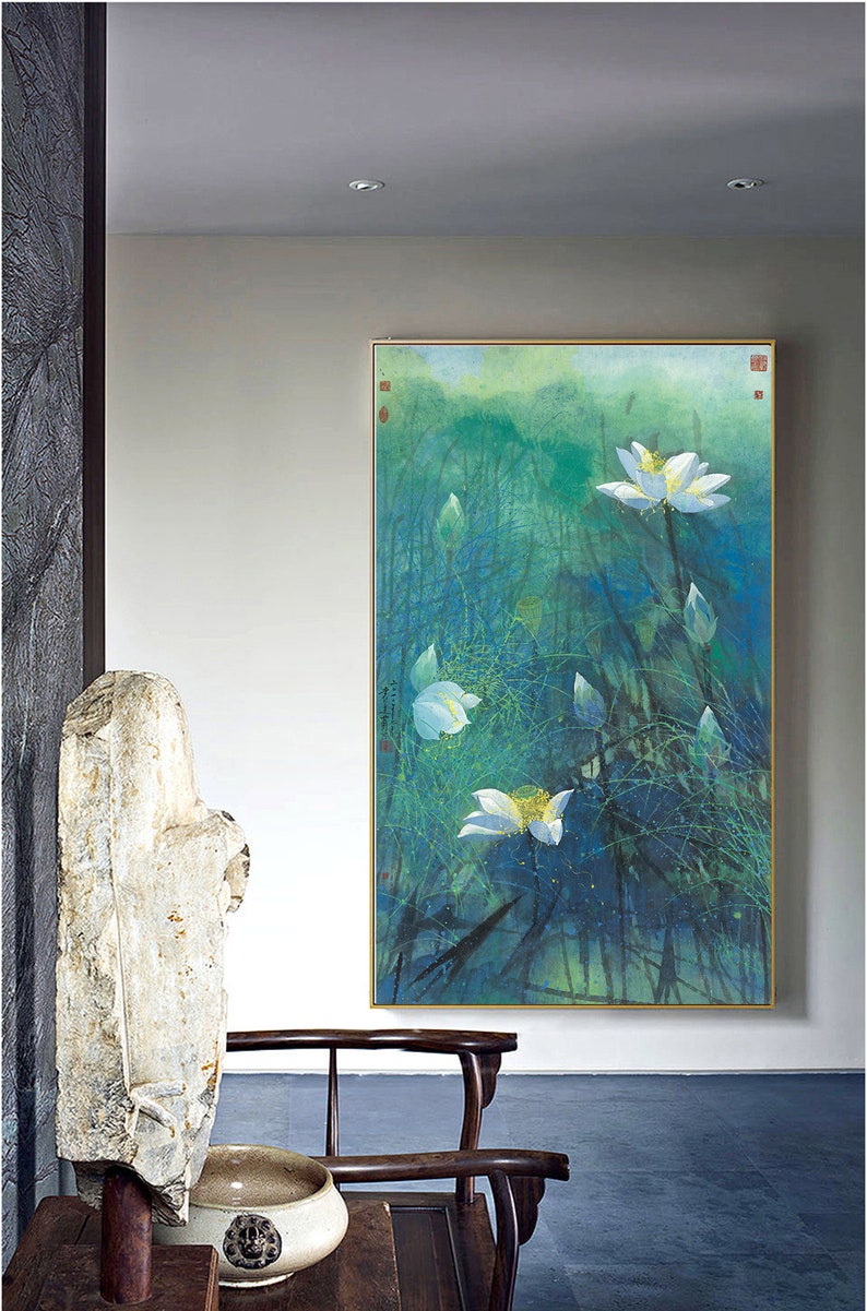 May include: A framed painting of white lotus flowers in a pond with a green and blue background. The painting is in a gold frame and is hanging on a white wall.