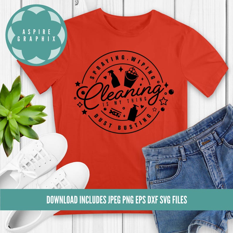 May include: A red t-shirt featuring a black circular design that reads "Spraying, Wiping, Cleaning is my thing, Dust Busting". The design incorporates cleaning icons such as a spray bottle, bucket, and cleaning products.