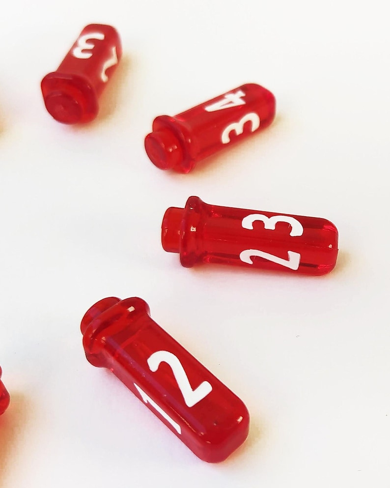 Four vial-shaped D4 dice on a white background. They have a red translucent finish with bold white numbers 1 through 4, resembling small potion bottles.