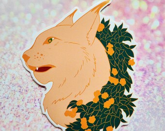 May include: A sticker featuring a stylized illustration of a lynx with a wreath of green leaves and orange berries around its neck.