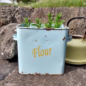 Blue enamel vintage flour bin with lots of character