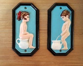 Set of two cast iron cinema toilet signs