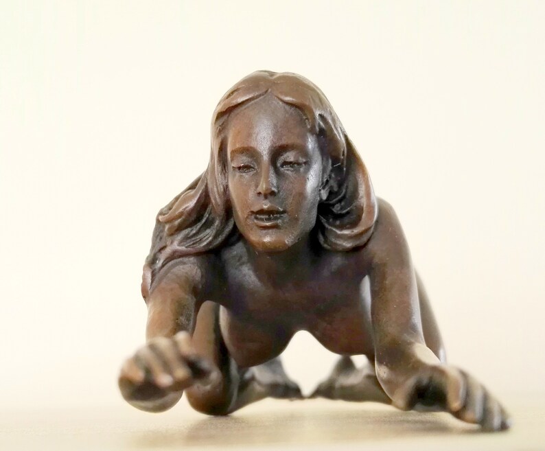 Erotic bronze artefact