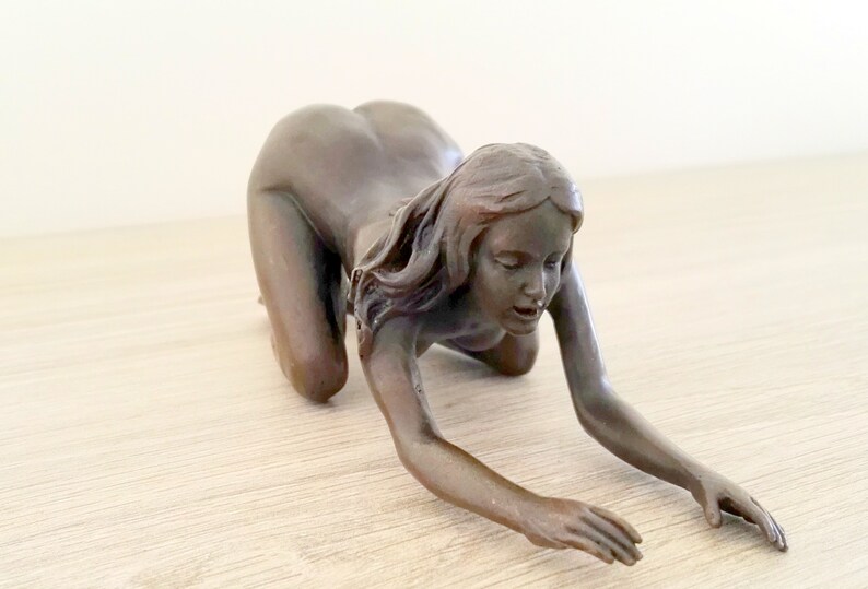 Erotic bronze artefact
