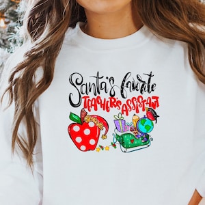 Santa&#39;s Favorite Teacher&#39;s Assistant Shirt - Gifts for School Staff - Teachers Aid Sweatshirt - Cute Holiday Tees - Gifts for Teacher Aides