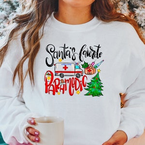 Santa&#39;s Favorite Paramedic Tee - Christmas Paramedic Sweater - EMT Xmas Shirt - Holiday Party Sweater - Christmas Gift for Paramedics