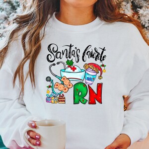 Santa's Favorite RN - RN Christmas Sweater - Nurse Sweatshirt - Nurse Shirt - Nurse Christmas Gift - RN Christmas Shirt