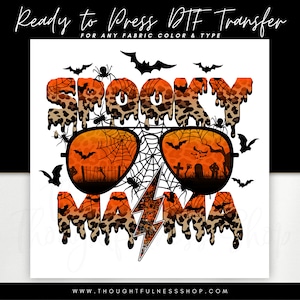 May include: Spooky Mama text with a dripping leopard print design and a pair of sunglasses with a spiderweb pattern. The sunglasses have a lightning bolt in the middle.