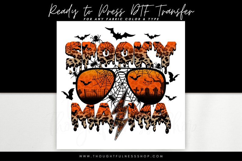 May include: Spooky Mama text with a dripping leopard print design and a pair of sunglasses with a spiderweb pattern. The sunglasses have a lightning bolt in the middle.