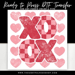 May include: Red and pink XOXO graphic with a checkered pattern. The graphic is surrounded by pink hearts. Ready to Press DTF Transfer for any fabric colour and type. www.thoughtfulnesssshop.com