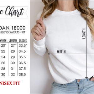May include: Size chart for a Gildan 18000 heavy blend sweatshirt. The chart shows the size, width in inches, length in inches, and sleeve length in inches for sizes S, M, L, XL, 2XL, and 3XL. The chart also states that the fit is unisex.