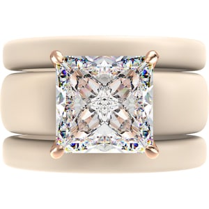 May include: A three-piece ring set featuring a princess-cut diamond engagement ring with a rose gold setting and two matching bands. The diamond is square-shaped and set with four prongs. The bands are a light cream color.