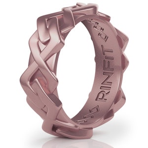 May include: A rose gold silicone ring with a braided design and the word "RINFIT" engraved on the inside.
