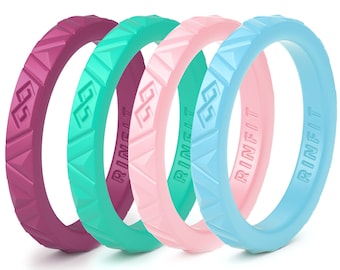 May include: Four silicone rings in different colors: purple, teal, pink, and light blue. Each ring has a raised, textured design and the word "RINGFIT" printed on the inside.