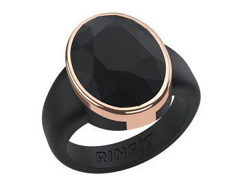 May include: Black ring with a large, faceted, oval-shaped black stone. The stone is set in a rose gold-colored bezel, and the band is black. The word "RINFIT" is embossed on the band.