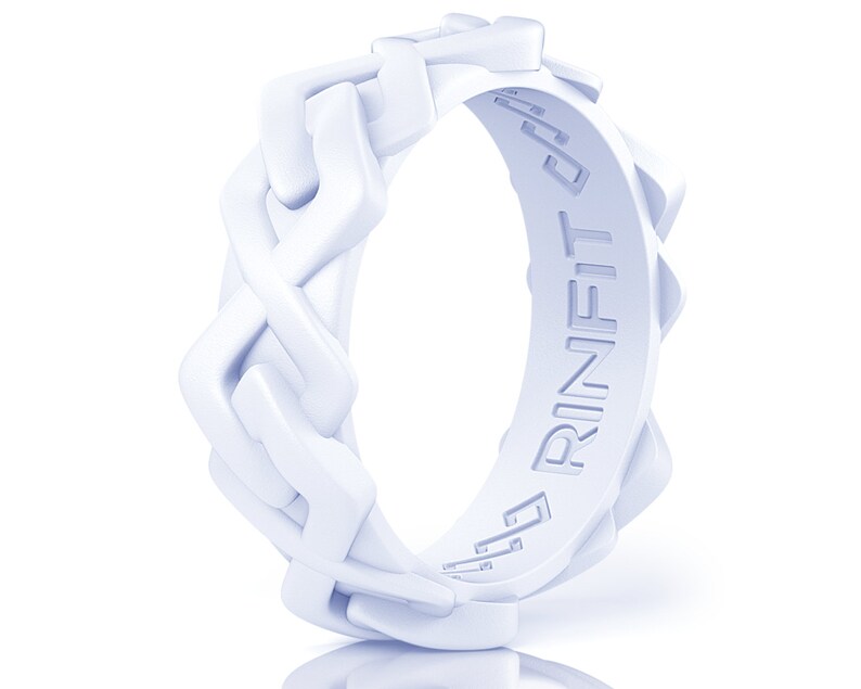 May include: A white silicone ring with a braided design and the word "RINFIT" embossed on the side.