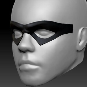 May include: A white 3D model of a face wearing a black mask that covers the eyes. The mask has a curved shape and is reminiscent of a superhero mask.