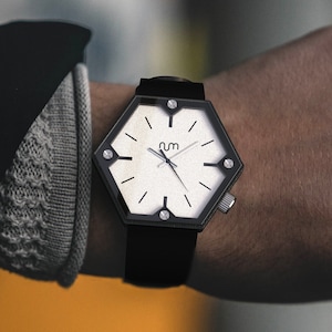 A hexagon wood watch on wrist