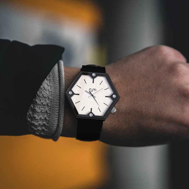 A hexagon wood watch on wrist