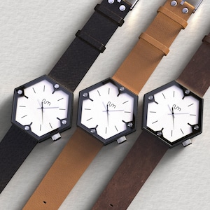 Three hexagon wood watches with different colored leather straps