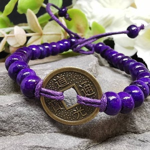 Purple Bali Good Luck Feng Shui Bracelet - 6mm Round Wooden Beads with Metal Feng Shui Coin. Adjustable Waxed Cord.