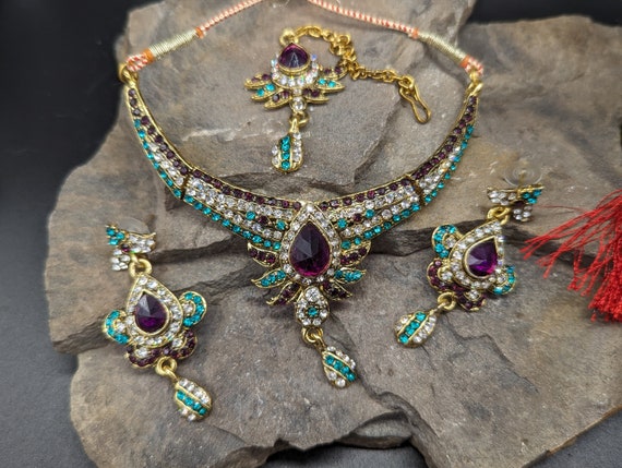Indian Style Adjustable Necklace, Earrings, Maang Tikka. Gold Coloured Metal, Set with Purple, Green and Clear Crystals.