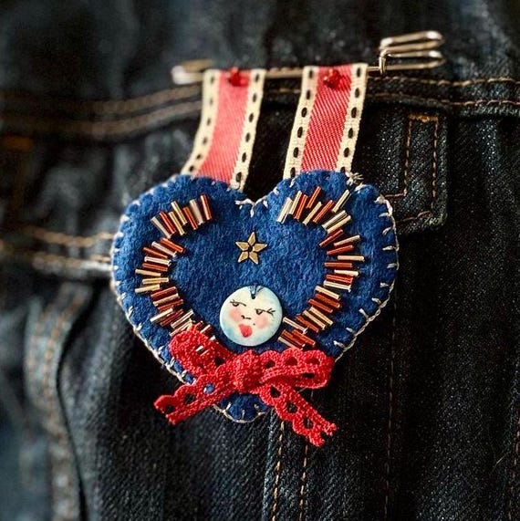 Unique Handmade Felt Heart-Shaped Beaded Pin/Brooch with Handpainted Ceramic Charm, Hung by Ribbon from Kilt Pin. Various styles available