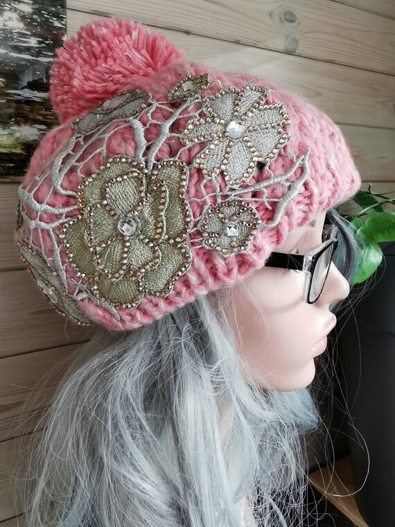 Bobble Hat. Pink, sparkly, embellished, pompom, chunky cable-knit. Knitted. 100% Acrylic. One size fits all.