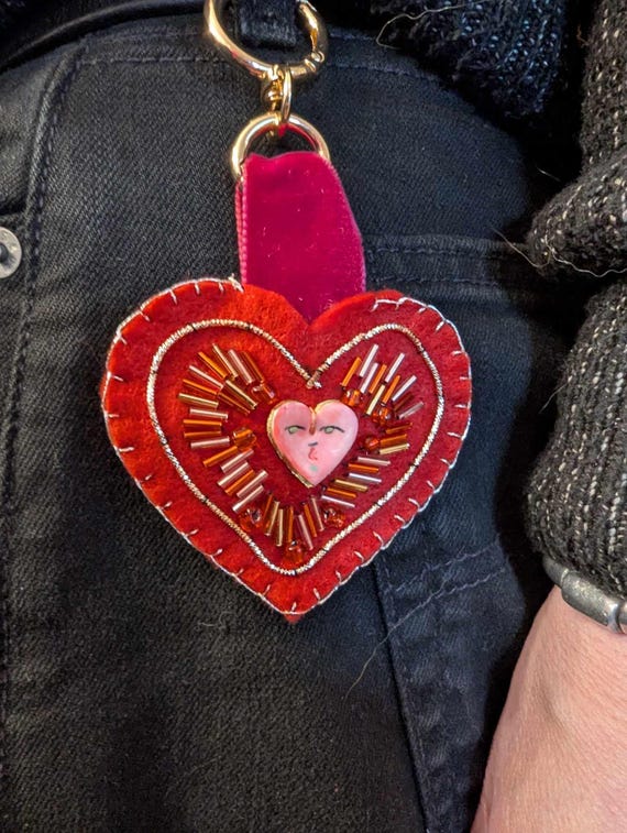 Unique Handmade Felt Heart-Shaped Beaded Zipper / Bag / Keyring Charm with Handpainted Ceramic Bead, Hanging from a Velvet Ribbon.