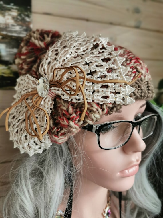 Bobble Hat. Red and beige, sparkly, embellished, pompom, chunky cable-knit. Knitted. 100% Acrylic. One size fits all.