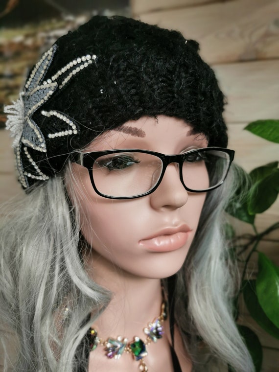Bobble Hat. Black, sparkly, embellished, pompom, chunky cable-knit. Knitted. 100% Acrylic. One size fits all.