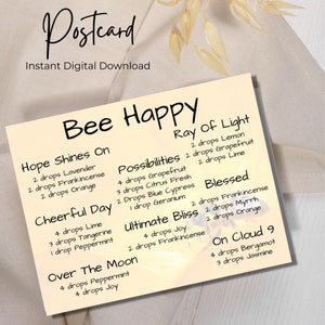 Puede incluir: Una postal amarilla con el texto "Bee Happy" en negro. La postal enumera diferentes mezclas de aceites esenciales con nombres como "Hope Shines On", "Ray of Light", "Possibilities", "Blessed", "Cheerful Day", "Ultimate Bliss", "Over The Moon" y "On Cloud 9". Cada mezcla enumera los aceites esenciales y la cantidad de gotas a utilizar.