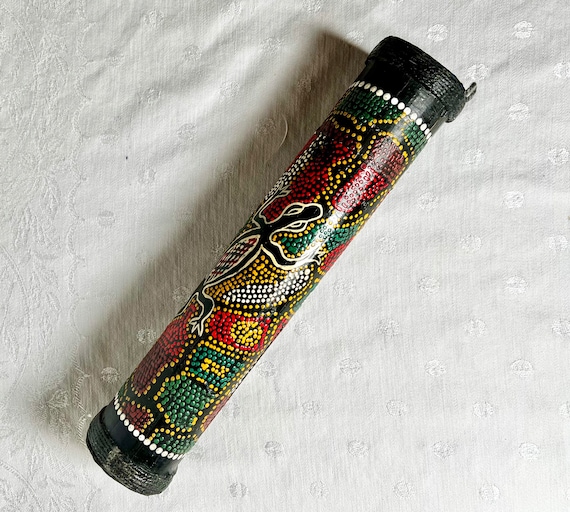 Percussion rain stick outlet