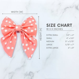 May include: A size chart for a pink and white polka dot bow with measurements in inches. The chart shows the width and height of the bow in inches for each size: extra small, small, medium, large, and extra large.