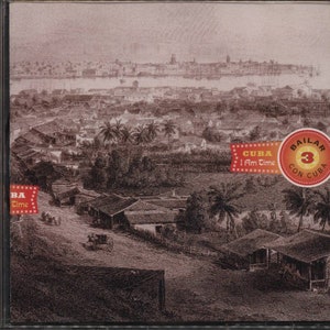 May include: CD case featuring a sepia-toned illustration of a Cuban cityscape with palm trees and buildings. The text "CUBA I Am Time" and "Bailar con Cuba 3" are displayed on the cover. The CD case is in a jewel case.