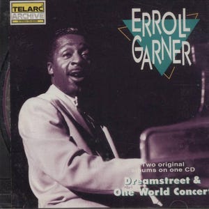 May include: A CD cover featuring a black and white photo of jazz pianist Erroll Garner. The cover is teal, yellow, and white with the text "Erroll Garner" in large white letters. The text "Two original albums on one CD Dreamstreet & One World Concert" is printed in white on a black background.