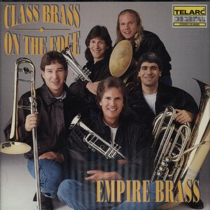 May include: CD cover featuring the Empire Brass ensemble. The image shows five men, each holding a brass instrument, including a trombone, trumpet, and tuba. The title "Class Brass On The Edge" is displayed at the top, with "Empire Brass" at the bottom.
