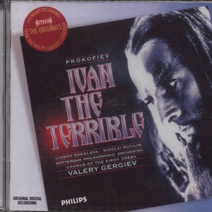 May include: A CD case featuring the album "Ivan the Terrible" by Prokofiev. The cover art displays a portrait of a man in shades of blue and gray, with the title in red and white. The Philips Classics logo is visible.