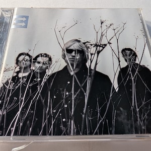 CD Echo de Tom Petty, 1999, Warner Bros. Álbum de rock clásico de los 90, artículo de colección musical.