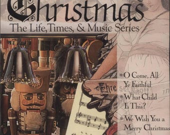 May include: A CD cover titled "Celebrating Christmas" with text "The Life, Times, & Music Series." Features a nutcracker, bells, and sheet music. The cover also includes the text "O Come, All Ye Faithful" and "We Wish You a Merry Christmas."