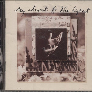 May include: CD case with a sepia-toned collage design. The cover features the handwritten text "My utmost for His highest" and a layered image including sheet music, hands, and floral elements. The overall aesthetic is vintage and artistic.