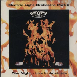 Peut inclure: Une pochette d'album noir et blanc avec le texte "Electric Light Orchestra Part II" et "One Night - Live In Australia". La pochette présente une image stylisée de flammes orange et jaunes.