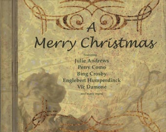 May include: A CD case with the title "A Merry Christmas" in a decorative font. The cover features a vintage design with the names of featured artists like Julie Andrews and Bing Crosby. The background has a textured, sepia-toned appearance.