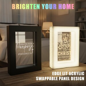 May include: Two illuminated acrylic panels with inspirational text. One panel is black with the words "Created with a Purpose" and Ephesians 2:10. The other panel is white and says "I can do all things through Christ". The text "Brighten Your Home" is at the top.
