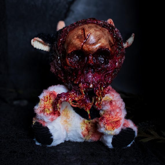 A handmade 'SlopJaw' creepy doll that sits at the intersection of horror art and plush toy — the kind of unsettling oddity that becomes the centerpiece of a goth shelf.
